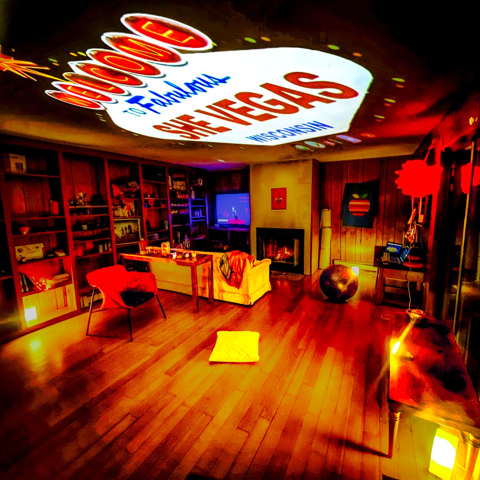 The SheVegas house interior, with bamboo flooring and a hand-painted Fabulous SheVegas sign across the ceiling.