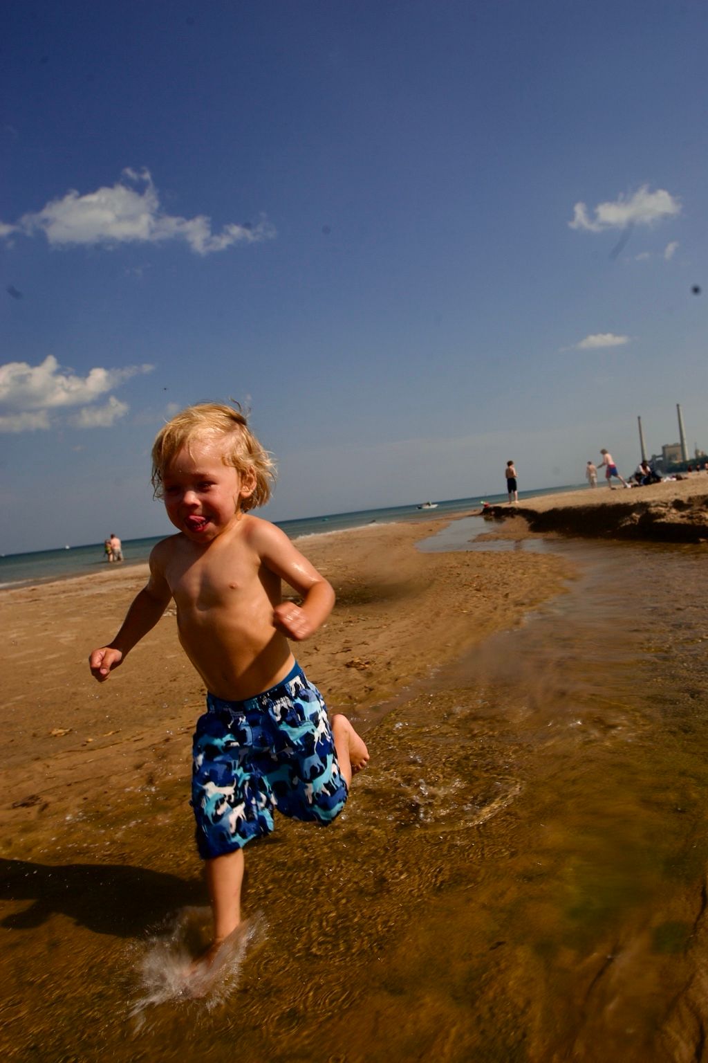 A child running at the edge of Lake Michigan in Sheboygan.