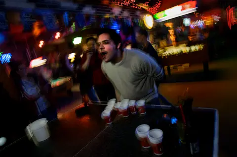 Beer pong and a crowded bar during the 2010 bar-night shoot.