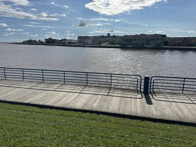 The Sheboygan River seen from the boardwalk, with the far bank across the water.